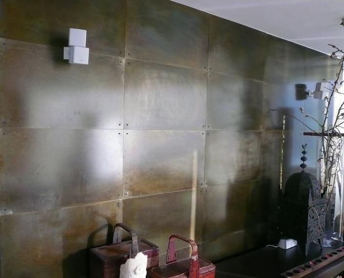 Steel wall panels with patina finish and steel rivets. For 